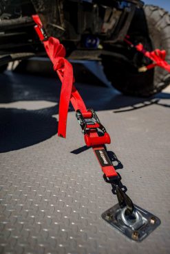 Red Ratchet Strap tie-down with a tied down on a trailer