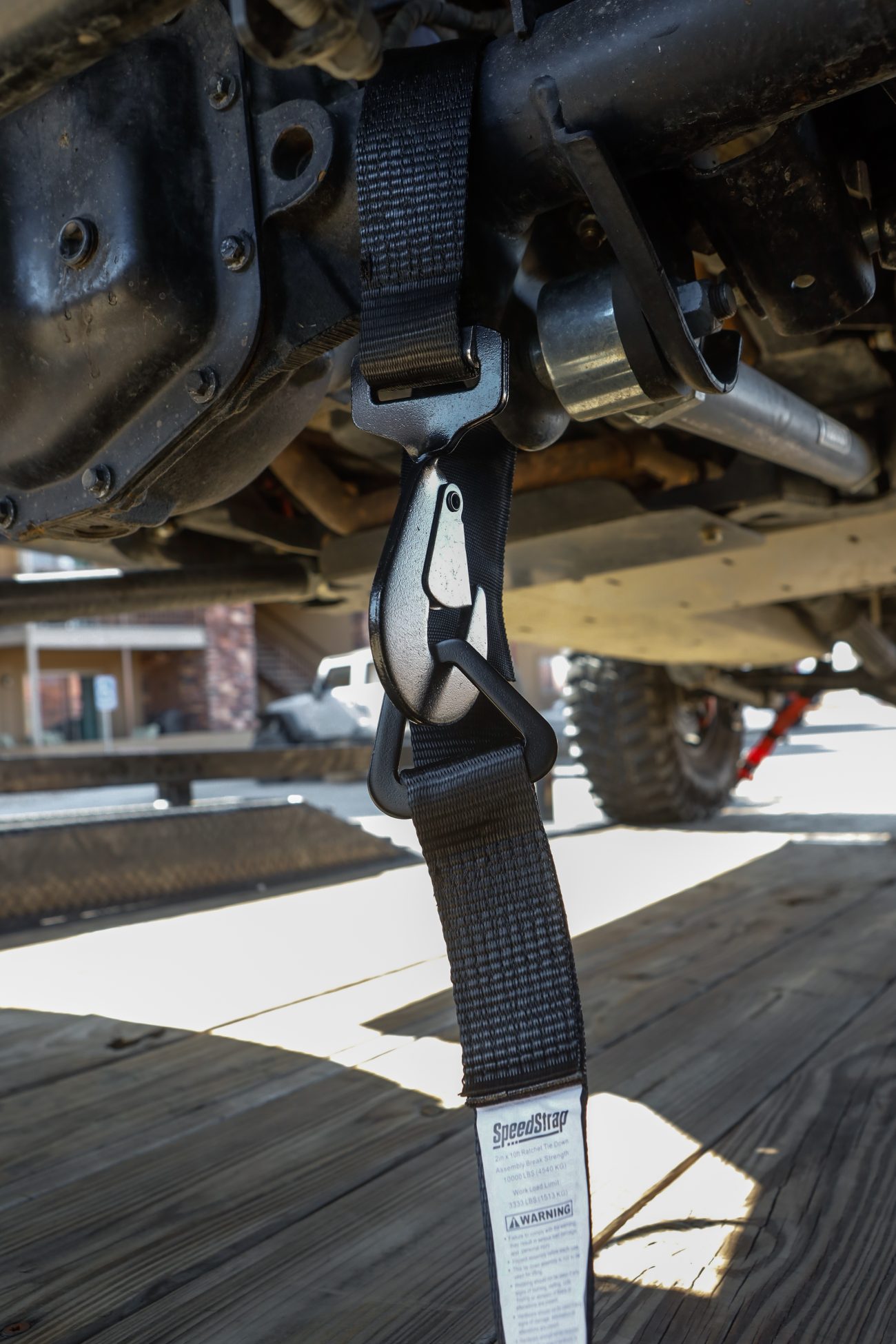 Close up view of axle strap attached to the axle