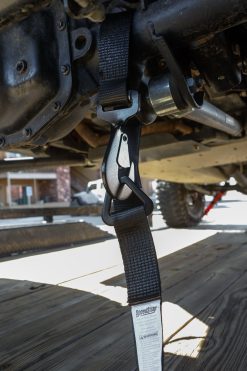 Close up view of axle strap attached to the axle
