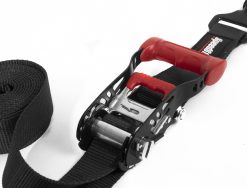 Black tie-down strap with a red ratchet mechanism closed