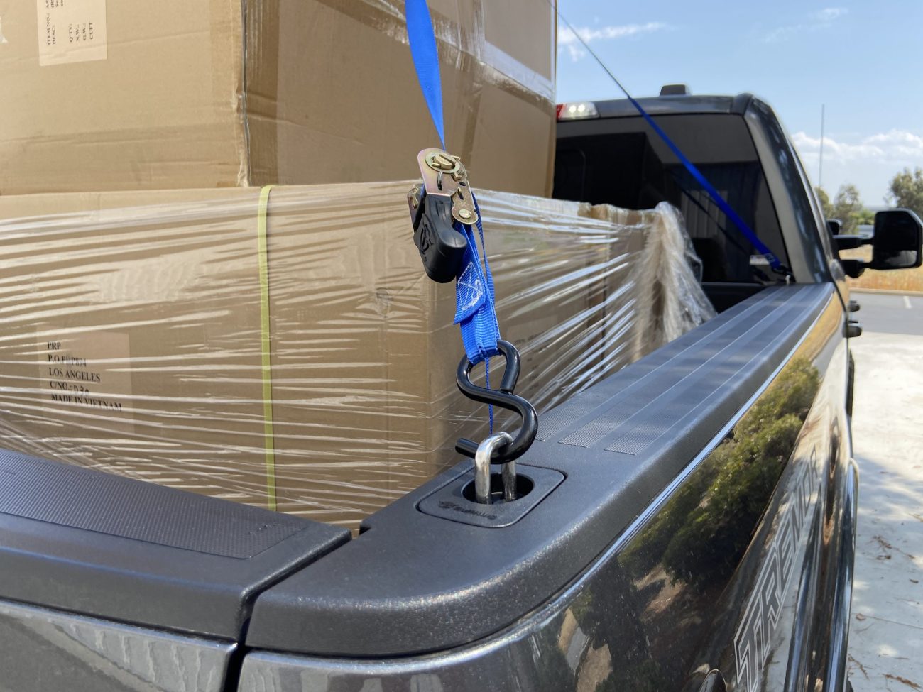 Raised Fit Retractable Tie Down Anchor with Tied Down Cargo in Truck Bed