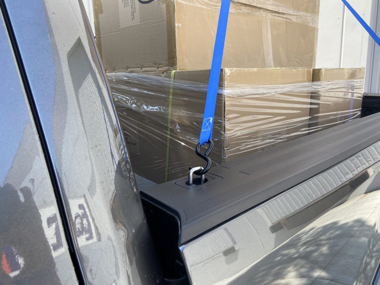 Raised Fit Retractable Tie Down Anchor with Tied Down Cargo in Truck Bed